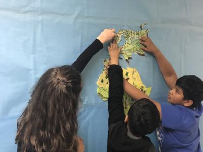 photo of student building a map of the world