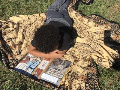 Students read outside in the beautiful fall weather